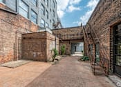 Thumbnail 39 of 40 - brick building with a gate at Life At Agora, Cleveland  