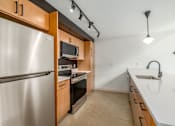 Thumbnail 8 of 40 - modern kitchen with fridge at Life At Agora, Cleveland, OH