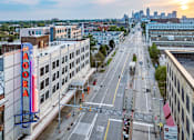 Thumbnail 30 of 40 - city street with a large Aura sign at Life At Agora, Ohio, 44103