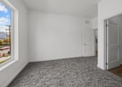 Thumbnail 30 of 58 - A room with white walls and a grey carpet. at The Lumos Apartments, Cleveland