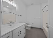 Thumbnail 25 of 58 - A white bathroom with a sink, toilet, and bathtub. at The Lumos Apartments, Cleveland 44106