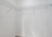 Thumbnail 10 of 44 - Empty wire shelving in a white room. at Park Lamont Townhomes Apartments, Cleveland