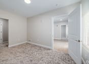 Thumbnail 31 of 44 - A room with a carpeted floor and white walls. at Park Lamont Townhomes Apartments, Ohio, 44106