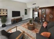 Thumbnail 6 of 48 - a living room with a couch and a tv