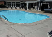 Thumbnail 31 of 56 - a swimming pool in the middle of a hotel pool at Heritage Apartments, Columbus, 43212