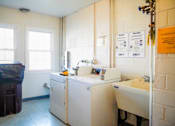 Thumbnail 18 of 20 - a kitchen with a washing machine and a sink