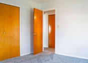 Thumbnail 9 of 20 - an empty room with two doors in it