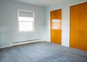 Thumbnail 8 of 20 - an empty room with a door and a window