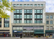 Thumbnail 23 of 35 - exterior of multi-story building from street view with retail stores on street level at Market Square Place, Pennsylvania
