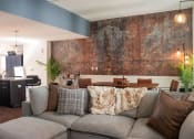 Thumbnail 13 of 35 - a living room with a couch and a wall with a mural on it at Market Square Place, Pennsylvania
