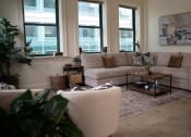 Thumbnail 2 of 35 - a living room with a couch and a table at Market Square Place, Pennsylvania