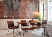 Thumbnail 11 of 35 - a dining room with a table and chairs and a large wall mural at Market Square Place, Pennsylvania