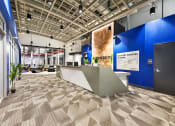 Thumbnail 30 of 35 - a view of a lobby with a reception desk and blue walls at Market Square Place, Pennsylvania