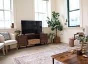 Thumbnail 3 of 35 - a living room with a couch and a television at Market Square Place, Pennsylvania
