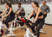 Thumbnail 24 of 35 - a group of people cycling on an exercise bike in a gym at Market Square Place, Pennsylvania