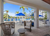 Thumbnail 21 of 46 - A Patio with Chairs at The Palmeri Residences, Naples, 34104