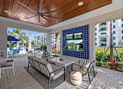 Thumbnail 20 of 46 - Outdoor Lounge with TV at The Palmeri Residences, Naples, Florida