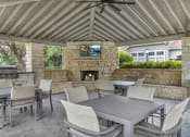 Thumbnail 6 of 31 - Poolside Patio with Outdoor TVs at River Stone Ranch, Austin, Texas