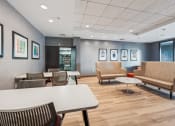 Thumbnail 15 of 23 - a clubroom with seating and a coworking space at Residences at Manchester Place in Manchester, New Hampshire