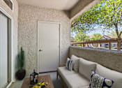 Thumbnail 6 of 27 - a small porch with a couch and a table at Altezza High Desert, Albuquerque, 87111