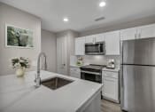 Thumbnail 1 of 31 - a kitchen with white cabinets and stainless steel appliances at River Stone Ranch, Austin
