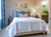 Thumbnail 24 of 37 - Bedroom with cozy bed at Wharf 7 Apartments, Charleston, SC