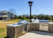 Thumbnail 36 of 37 - outdoor grilling station at Wharf 7 Apartments, South Carolina, 29492