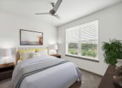 Thumbnail 3 of 22 - a bedroom with a large bed and a ceiling fan at Glenwood at Grant Park Apartments, Atlanta, Georgia