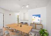 Thumbnail 10 of 26 - a dining room with a wooden table and chairs at Highlands at Faxon Woods, Quincy, Massachusetts