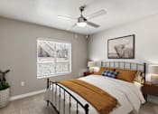 Thumbnail 3 of 27 - the bedroom of a home with a bed and a ceiling fan at Altezza High Desert, Albuquerque, New Mexico