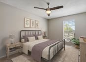 Thumbnail 4 of 33 - a bedroom with a bed and a ceiling fan at Acacia Gardens, New Mexico, 87111