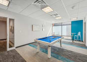 Thumbnail 18 of 23 - a game room with a pool table at Residences at Manchester Place in Manchester, New Hampshire