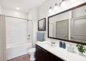 Thumbnail 5 of 22 - a bathroom with a sink and a shower and a toilet at Glenwood at Grant Park Apartments, Atlanta, GA, 30316