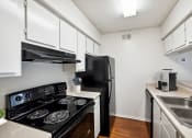 Thumbnail 3 of 14 - Kitchen with Black Appliance at Great Hills, Austin, TX