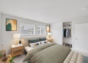 Thumbnail 3 of 12 - a bedroom with a large bed and a walk in closet at 2300 West Apartments, Reno, Nevada