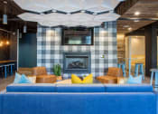 Thumbnail 26 of 52 - a living room with a blue couch and a fireplace at 511 Meeting, South Carolina, 29403