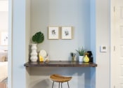 Thumbnail 18 of 52 - a desk with a chair and a vase with a plant on it at 511 Meeting, Charleston, 29403