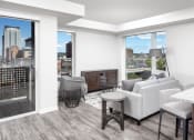 Thumbnail 15 of 40 - a living room with a view of the city at Maven on Broadway, Minnesota