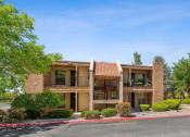 Thumbnail 7 of 33 - a building with a porch and a street in front of it at Acacia Gardens, Albuquerque, NM, 87111