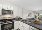 Thumbnail 1 of 23 - kitchen with stainless steel appliances at the Residences at Manchester Place in Manchester, New Hampshire