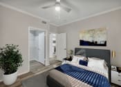 Thumbnail 5 of 31 - a bedroom with a large bed and a ceiling fan at River Stone Ranch, Texas