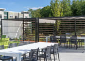 Thumbnail 29 of 33 - a patio with a table and chairs at Edgebrook Residences, New Hampshire