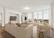 Thumbnail 9 of 36 - a living room with white couches and a large window at Paramount on Lake Eola, Orlando, Florida