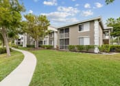Thumbnail 10 of 31 - Outdoor walkway and patios at Promenade at Reflection Lakes, Fort Myers, FL, 33907