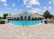 Thumbnail 11 of 23 - Community Pool with Lounge Chairs at Ballantrae Apartments, Sanford