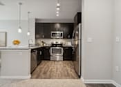 Thumbnail 1 of 29 - Kitchen with Stainless Steel Appliances at Village at Terra Bella Apartments, FL