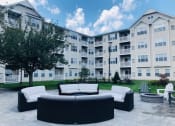 Thumbnail 22 of 26 - Outdoor patio with lounge seating at Highlands at Faxon Woods, Quincy