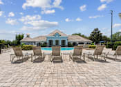 Thumbnail 13 of 23 - Community Pool with Lounge Chairs at Ballantrae Apartments, Sanford