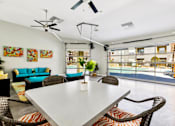 Thumbnail 20 of 27 - A White Dining Table at Flats on Chapel Apartments, Waco, TX