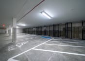 Thumbnail 33 of 33 - a empty parking garage with rows of storage space at Edgebrook Residences, Merrimack New Hampshire